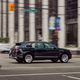 A Bentley SUV drives through an intersection.